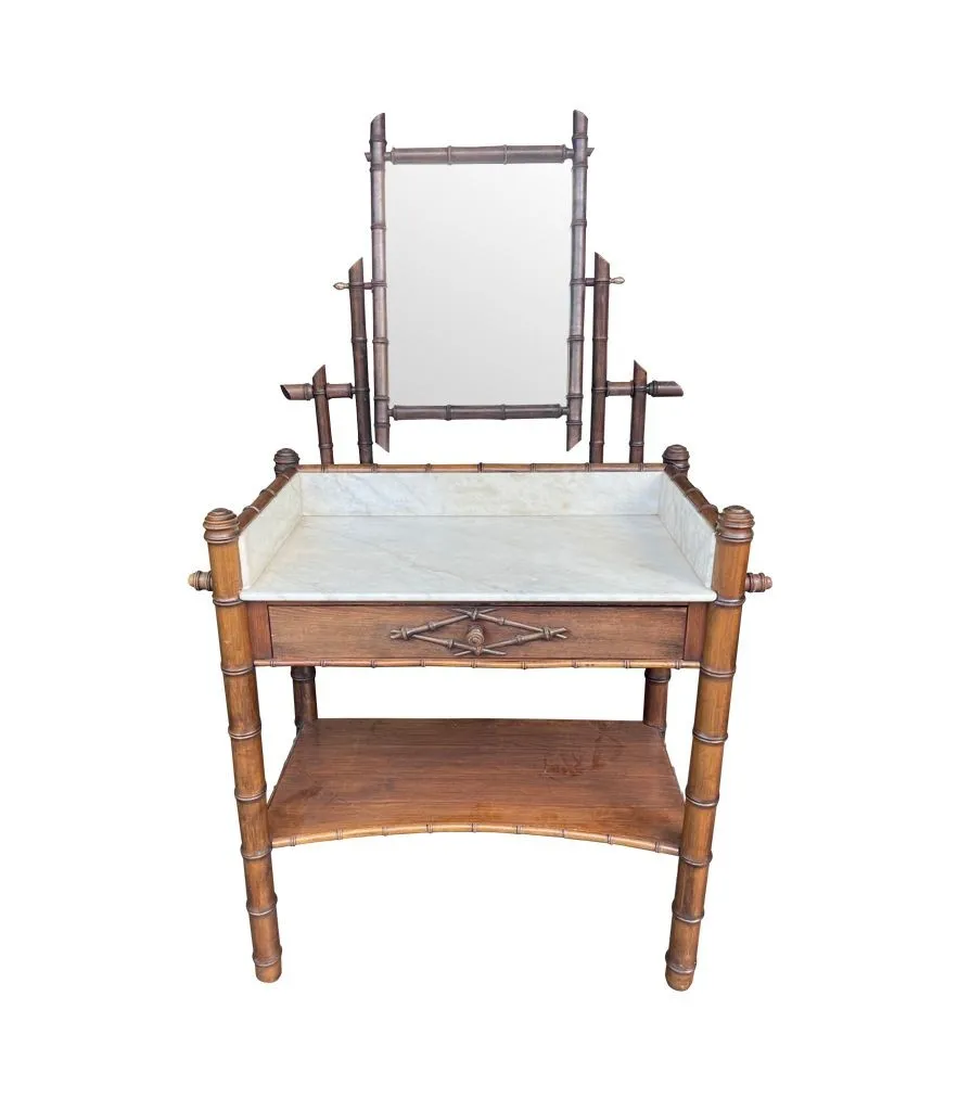 A 1920s faux bamboo and white Carrara marble dressing table with central mirror and drawer.