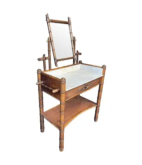 A 1920s faux bamboo and white Carrara marble dressing table with central mirror and drawer.