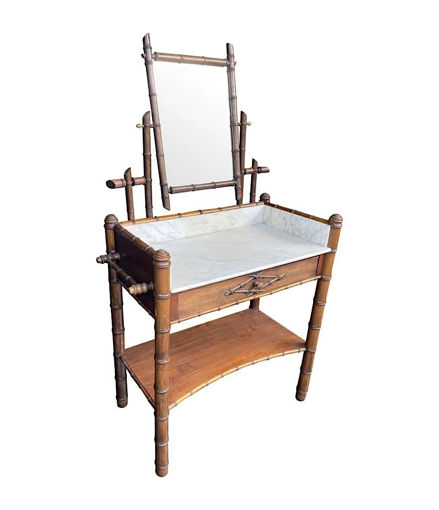 A 1920s faux bamboo and white Carrara marble dressing table with central mirror and drawer.