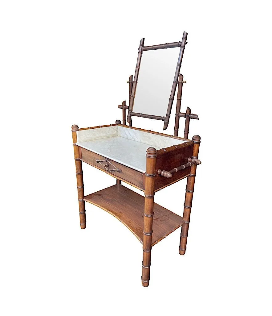 A 1920s faux bamboo and white Carrara marble dressing table with central mirror and drawer.