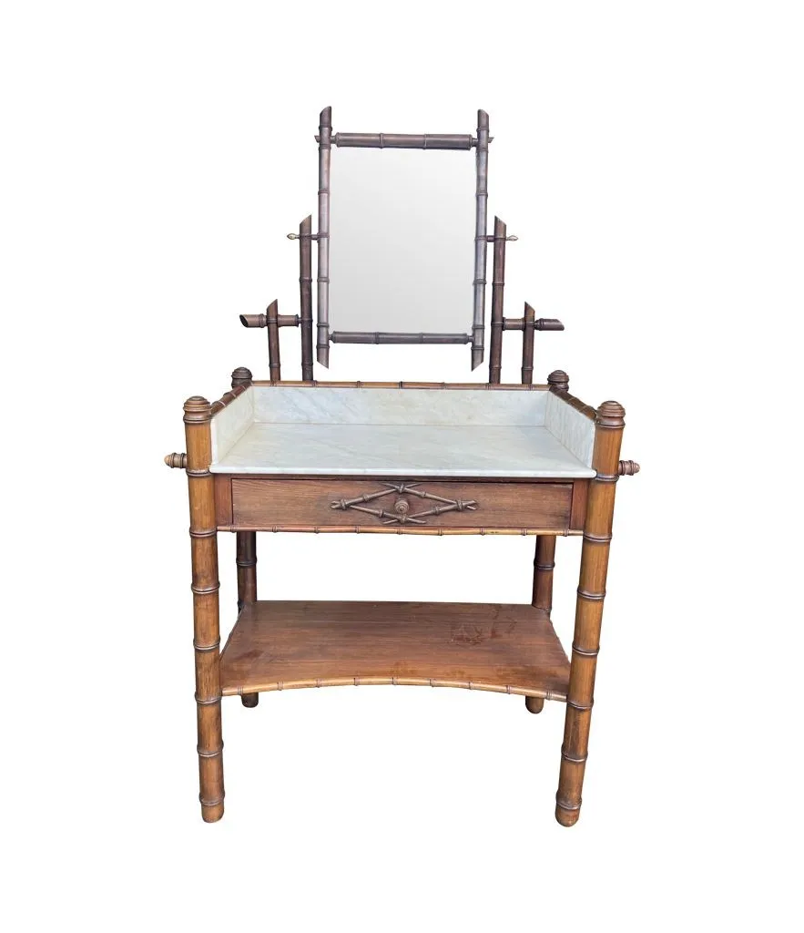 A 1920s faux bamboo and white Carrara marble dressing table with central mirror and drawer.