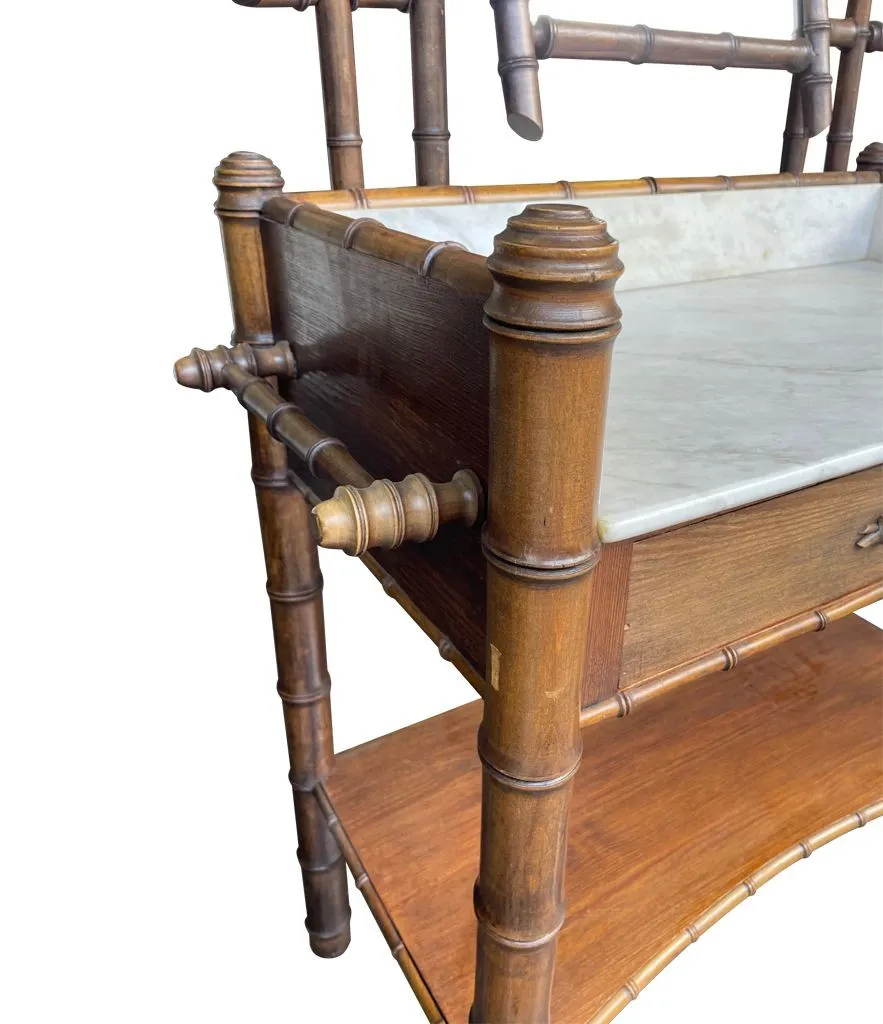 A 1920s faux bamboo and white Carrara marble dressing table with central mirror and drawer.